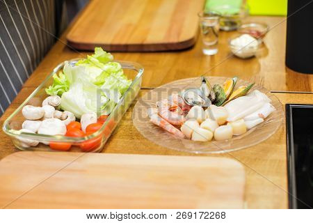 Slice Pizza In Box And Can Of Soda On Wood Background