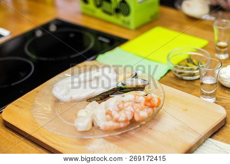 Slice Pizza In Box And Can Of Soda On Wood Background