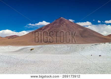 Borax Deposits At Laguna Colorada Lake With Mountain Peaks In The Background, Bolivia