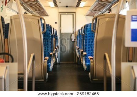 Empty Train Interior In Germany For Moving People For Long And Short Distations. Corridor And A Lot 