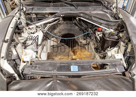 Car Repair In The Back Of The Suv With A View Of The Engine Compartment With The Engine Removed And 