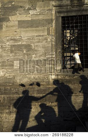 Istanbul, Turkey - September 8, 2010: A Boy Was Climbing To The  Window On The Wall. There Was A Man