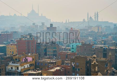 Aerial View Of Islamic Cairo In Morning Winter Fog, The Silhouettes Of Tall Minarets And Saladin Cit