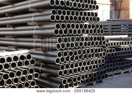 Plastic Pipes In Stock Of Finished Products Stacked In Packs