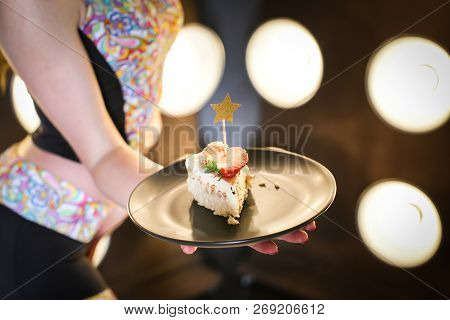 Close Up View Of Woman Holding Piece Of Homemade Cake On Plate In Hands