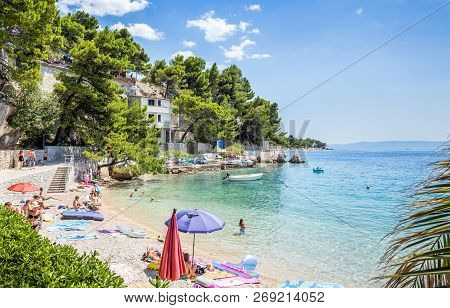 Brela, Croatia - July 20, 2018: Tourists Relaxing On Marvelous Brela Beach, Beautiful Mediterranean 