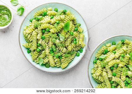 Tasty Appetizing Italian Pasta Al Bronzo With Pesto Sauce, Green Pea, Basil And Cheese Served On Pla
