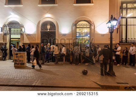 Salta, Argentina - April 8, 2015: Long Line Of People Waiting For Atm In Salta.