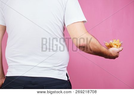 Glutton Man With Fast Food. Weight Gain, Hunger, Nutrition Choices, Unhealthy Diet And Imbalanced Ra