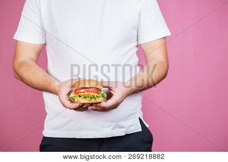 Glutton Man Eating Tasty Burger. Imbalanced Ration, Snacking With Fast Food, Unhealthy Diet