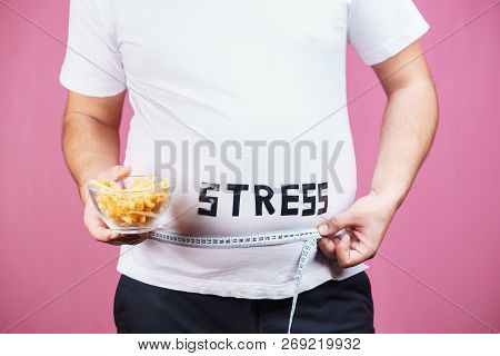 Stress, Eating Problems, Compulsive Overeating, Fat Food, Weight Gain. Overweight Man With Appetizin