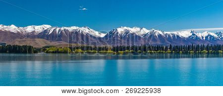 Lake Ruataniwha, New Zealand, South Island, trees and mountains, water reflections