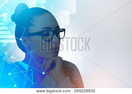 Pensive Young Businesswoman In Glasses Sitting On Ver White Background With Immersive Network Interf
