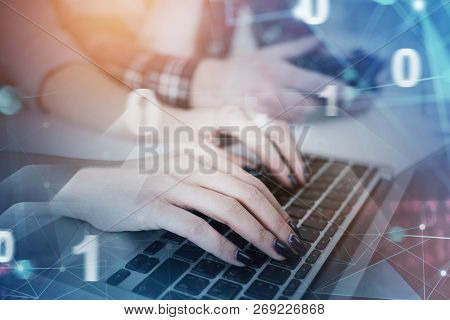 Hands Of Businesswomen Typing On Laptop In Office With Double Exposure Of Digital Interface. Toned I
