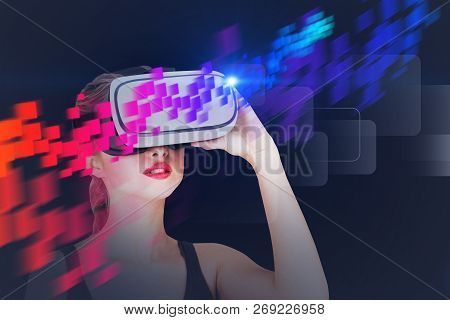 Young Woman Wearing Black Tank Top And Vr Glasses Over Black Background With With Red And Purple Flo