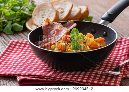 Scrambled Egg With Tomato Sliced, Bacon Grill On Pan And Breads, Homemade Breakfast.