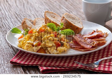 Scrambled Egg With Tomato Sliced, Bacon Grill And Breads, Homemade Breakfast.