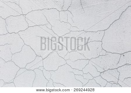 Texture Of White Dirty Cracked Wall. Small Straight Cracks. Direct Fracture On Painted Surface. Cell