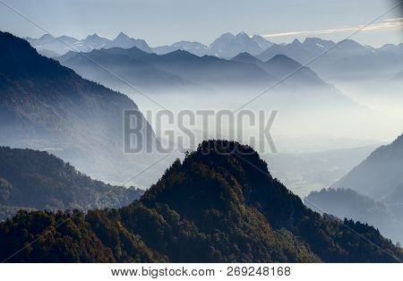 Swiss Mountain Landscape In Backlight Fog From Mount Bürgenstock Towards Bernese Alps