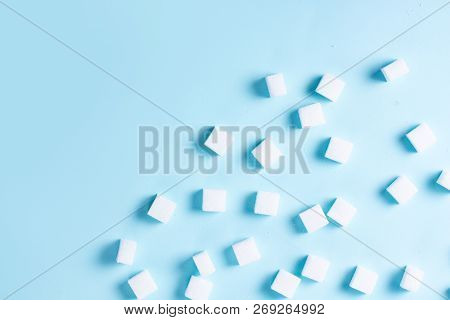 Sugar Cubes On Plain Blue Background, Flat Lay Scene With Copy Space