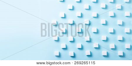Sugar Cubes Regular Pattern On Blue Background, Flat Lay Banner With Copy Space
