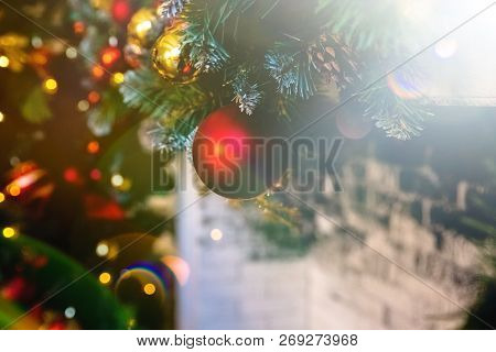 Red Christmas Ball Hanging On Christmas Tree. Home Decor For Winter Holidays. Colorful Shiny Glotter