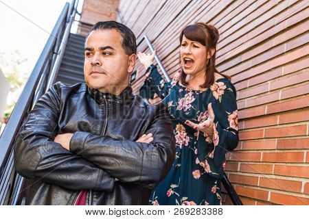 Unhappy Mixed Race Couple In An Argument.