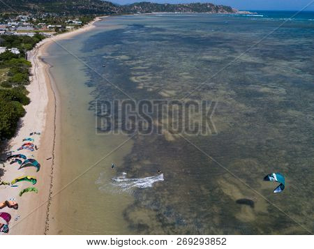 Phan Rang, Vietnam - 11 2018: Kiteboarding, Kite Surf. Extreme Sport Kitesurfing In Tropical Blue Oc