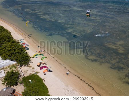 Phan Rang, Vietnam - 11 2018: Kiteboarding, Kite Surf. Extreme Sport Kitesurfing In Tropical Blue Oc