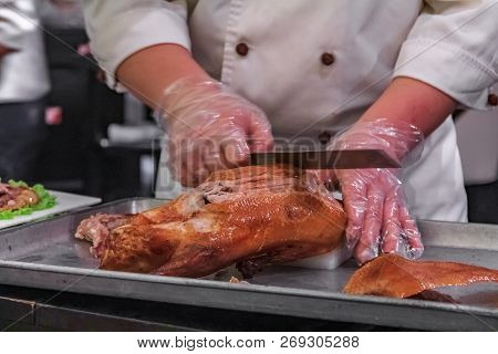 Traditional Chinese Roast Duck Or Da Dong Kaoya Served Tableside At A Chinese Restaurant