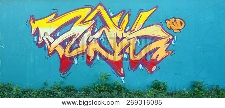 Full And Acomplished Graffiti Artwork. The Old Wall Decorated With Paint Stains In The Style Of Stre