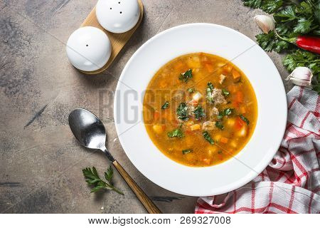 Traditional Hungarian Goulash Soup On The Stone Table. European Cuisine. Top View With Copy Space,