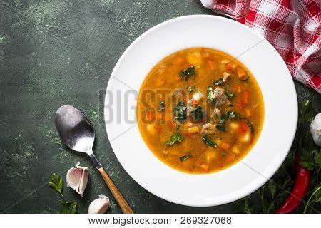 Traditional Hungarian Goulash Soup On The Table. European Cuisine. Top View With Copy Space,