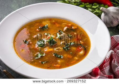 Traditional Hungarian Goulash Soup On The Table. European Cuisine.