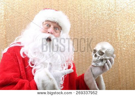 Santa Claus. Santa Claus holds a Human Skull. Santa finds an old Elf Skull. Old Man Winter is scared. Sold my soul to Santa. 