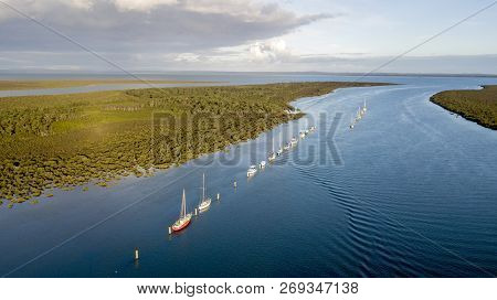 Boats At Ancorage In The River With Sea Entrance  Aerial Photo