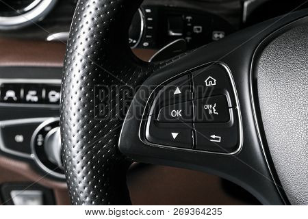 Media And Navigation Control Buttons On A Steering Wheel Of A Modern Car. Car Interior Details. Brow