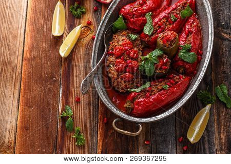 Baked Red Ramiro Peppers Stuffed With Rice And Walnuts, Rustic Style, Copy Space.