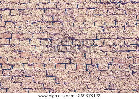Distressed Yellow And Orange Stone Masonry Background With Clay. Brick Masonry Walls Or As Part Of A