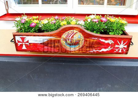 Tallinn, Estonia - August 30, 2018: Flower Pot With Flowers On Verine Street. On A Very Narrow Stree