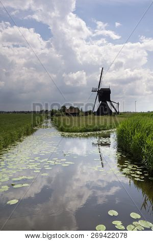 View Of The Scheijwijk Mill Near Hoornaar With An Approaching Thunderstorm In The Background