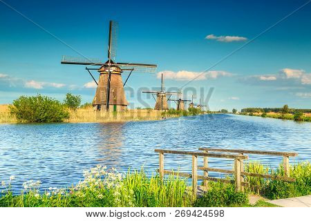 Fabulous Touristc Place, Beautiful Water Canal In Kinderdijk With Traditional Old Dutch Windmills, U