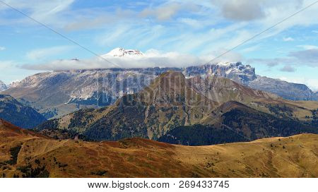 Gruppo Sella In The Middle Of Clouds And Araba Village Tourist Resort, Alps Dolomites Mountains, Ita
