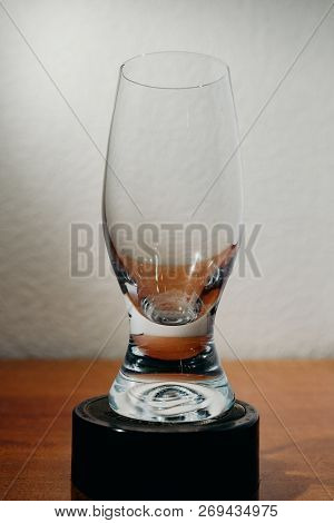 Dirty Glass Of Smusy With The Superheated Grounds On A White Background