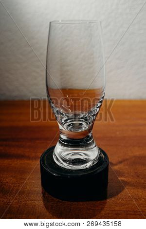 Dirty Glass Of Smusy With The Superheated Grounds On A White Background
