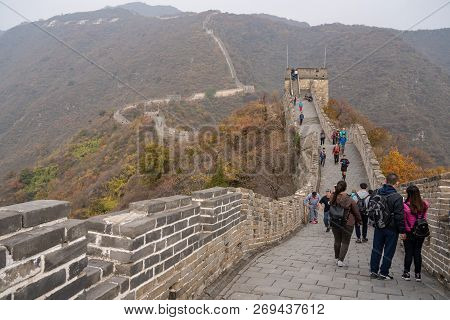 Mutianyu, China - 20 October 2018: Cleaner On The Great Wall Of China At Mutianyu Sweeping Litter