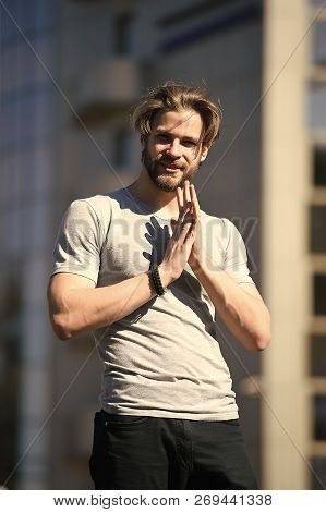 Man With Beard And Haircut In Grey Tshirt Standing On Sunny Day Outdoors On Streetscape. Sportswear 