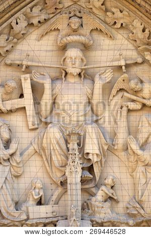 WURZBURG, GERMANY - JULY O4, 2018: The tympanum shows the Last Judgment, portal of the Marienkapelle in Wurzburg, Bavaria, Germany