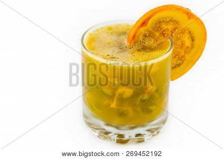Traditional Colombian Beverage Made Of Juice And Pieces Of Lulo (solanum Quitoense) Called Lulada