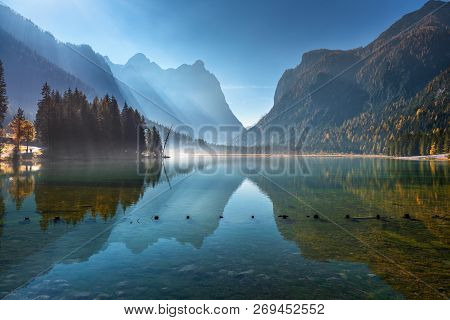 Majestic Mountains Reflected In Water In Beautiful Dobbiaco Lake At Sunny Morning In Autumn.  Fall I